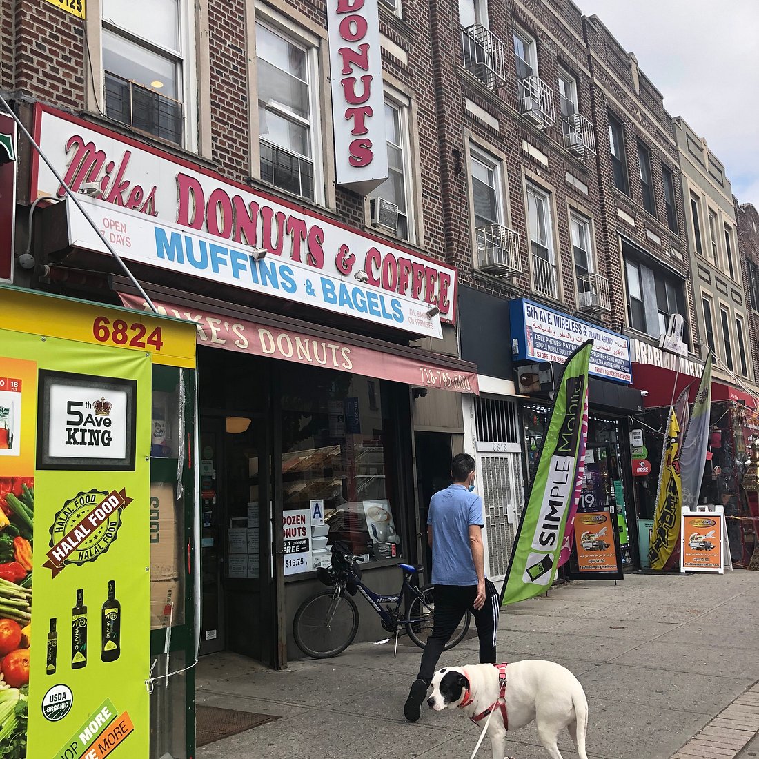 Mike's Donuts & Coffee entrance with the red awning on Fifth Avenue